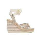 Beige wedge sandal with espadrille sole on a white background