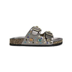 Silver sandal with gemstone embellishments on a white background