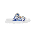 White sandal with blue bejeweled floral pattern and embellishments