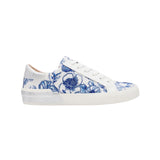 White sneaker with blue floral pattern on a white background