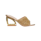 Gold embellished high-heeled shoe