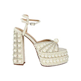 Elegant high-heeled shoe with pearl embellishments