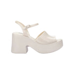 White platform heel with white strap and buckle closure
