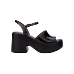 Black platform heels with black strap & buckle closure
