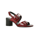 Red heel with decorative straps block block heel and buckle closure
