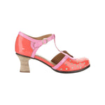 Red polka dot shoe with pink strap and buckle closure