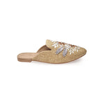 neutral tan colored slide mule with floral ribbon embroidery