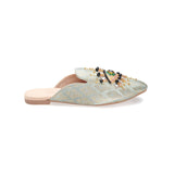 neutral colored slide mule with eye beaded embroidery detail