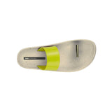 Beige sandal with yellow strap and a metallic toe catch 