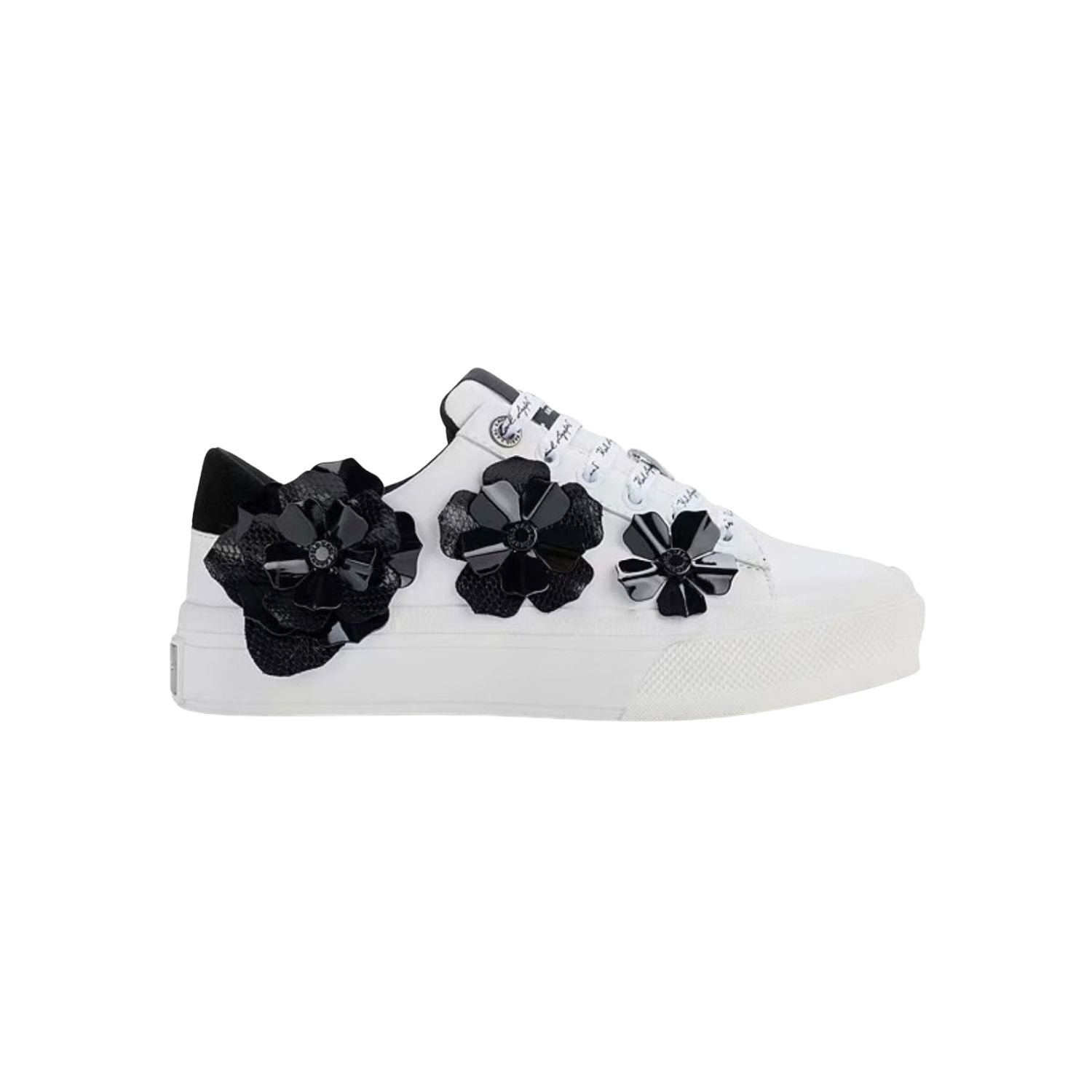A white Karl Lagerfeld Georgia sneaker with black floral ornament details on the side 