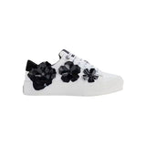 A white Karl Lagerfeld Georgia sneaker with black floral ornament details on the side 