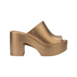 gold colored bubblegum scented heeled mule slip on sandal