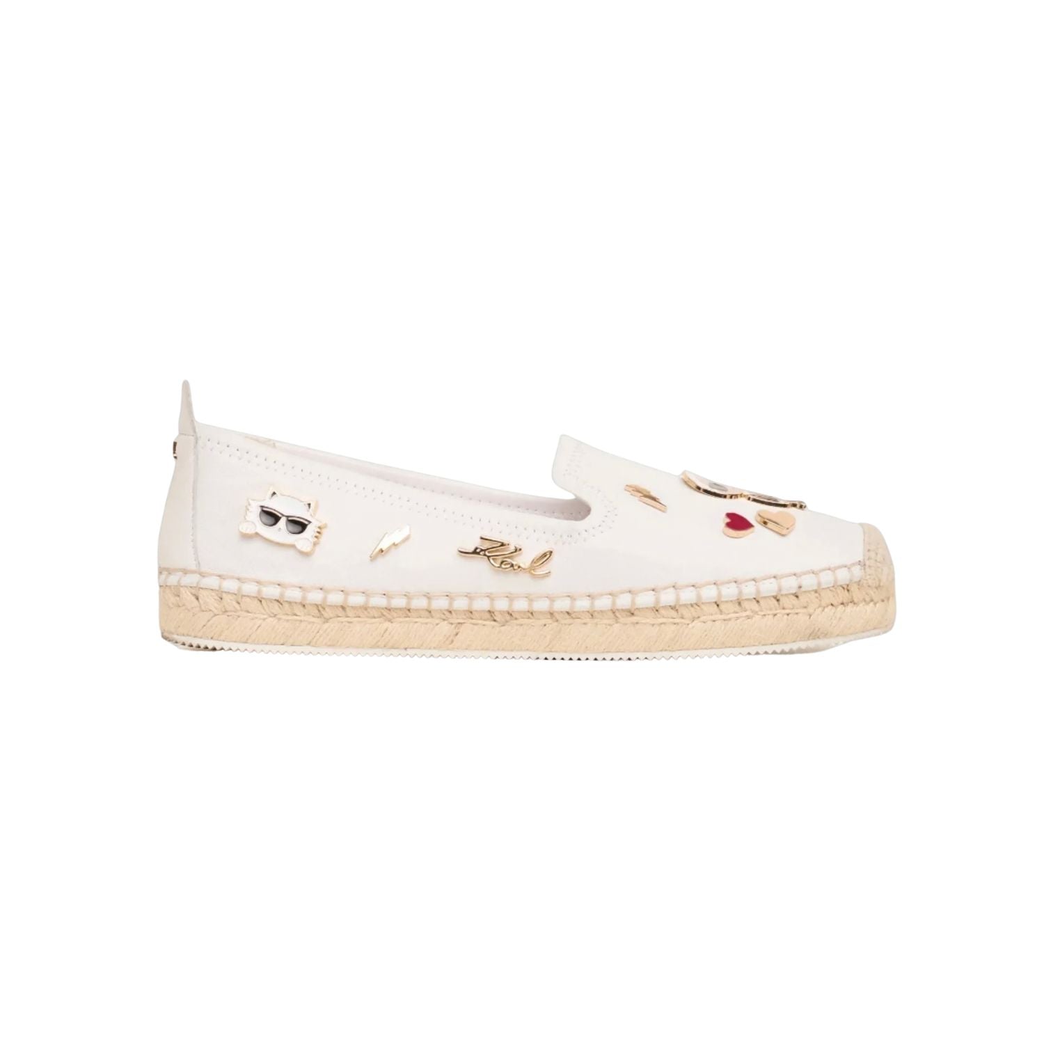 White flat moccasin-styled shoe with decorative elements 