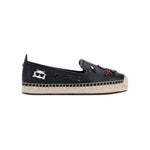 Black flat moccasin-styled shoe with decorative elements 