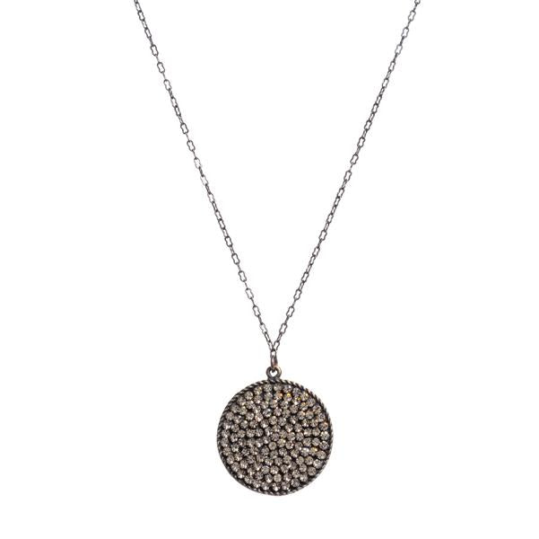 Rebel round disc pave necklace. Antique brass finish with black diamond crystals. Lobster clasp closure. 16" chain. Handmade in New York.