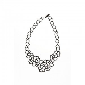 Sweet Flowers necklace by Batucada features delicate and intricate flowers. Hand crafted from materials that are 100% recyclable. This is made from vegetable based products and certified sustainable polymers. Silicone-free, latex-free, nickel-free.