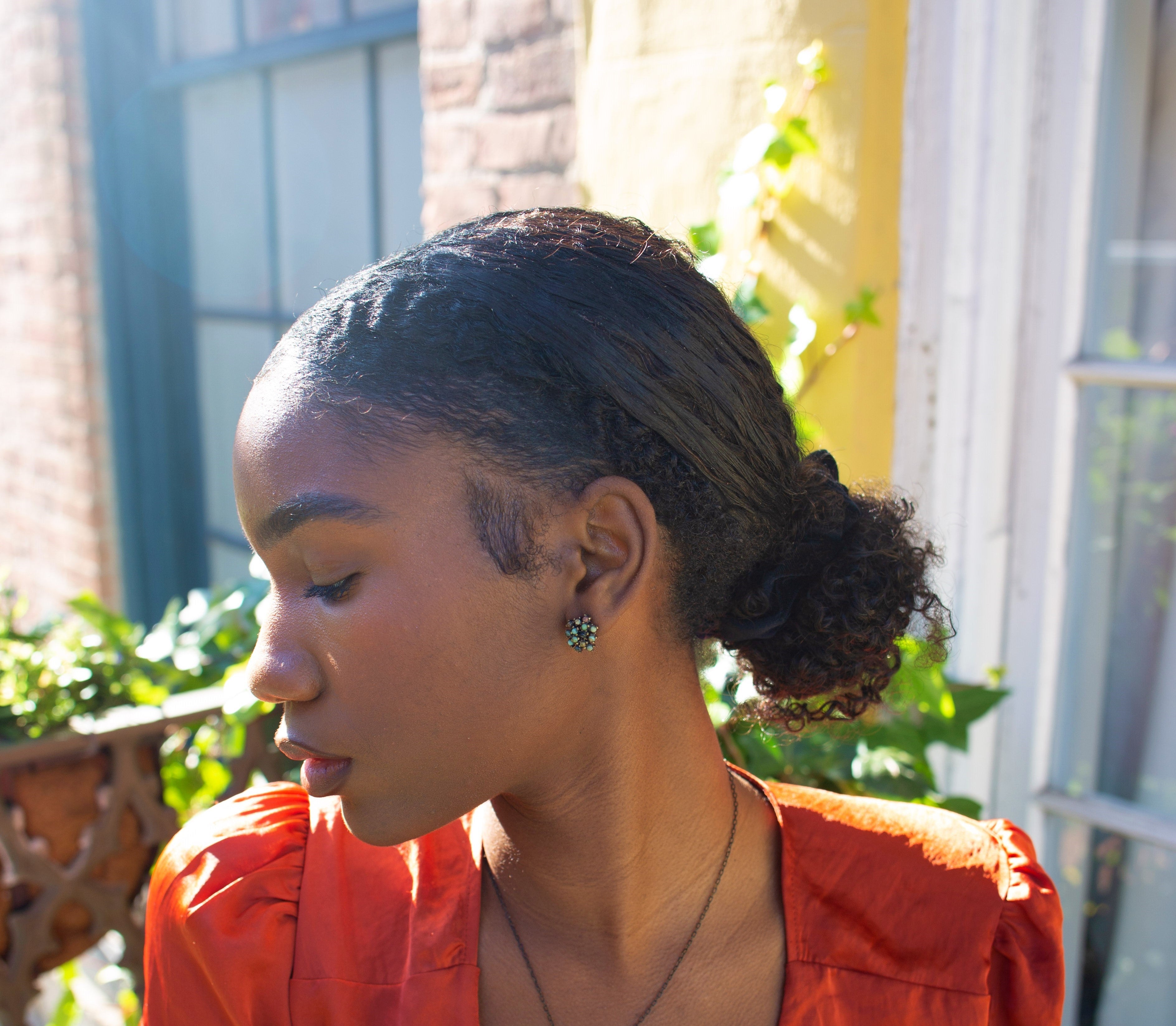Rebel cluster stud earrings. Antique brass finish with African turquoise beads. Handmade in New York.